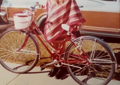 Linda standing near her bike