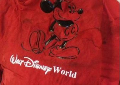 Red Walt Disney World shirt with Mickey Mouse on it