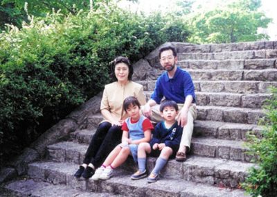 Setagaya Family sitting on steps outside