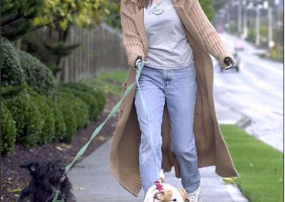 Mary Vincent happily walking 2 dogs