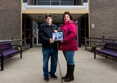 Tracy’s father, Billy Kirkpatrick (left), and Tracy’s sister, Deonda Kirkpatrick (right), holding a beloved photo of Tracy.