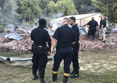 First responders with the remains of the Krentel’s home.