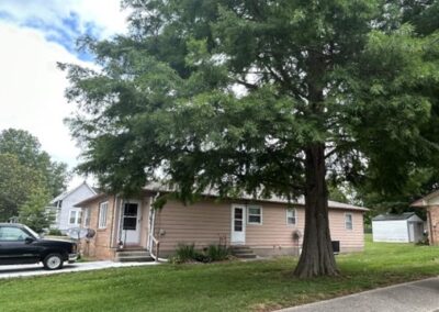 The duplex in June of 2023, as shown from the side.