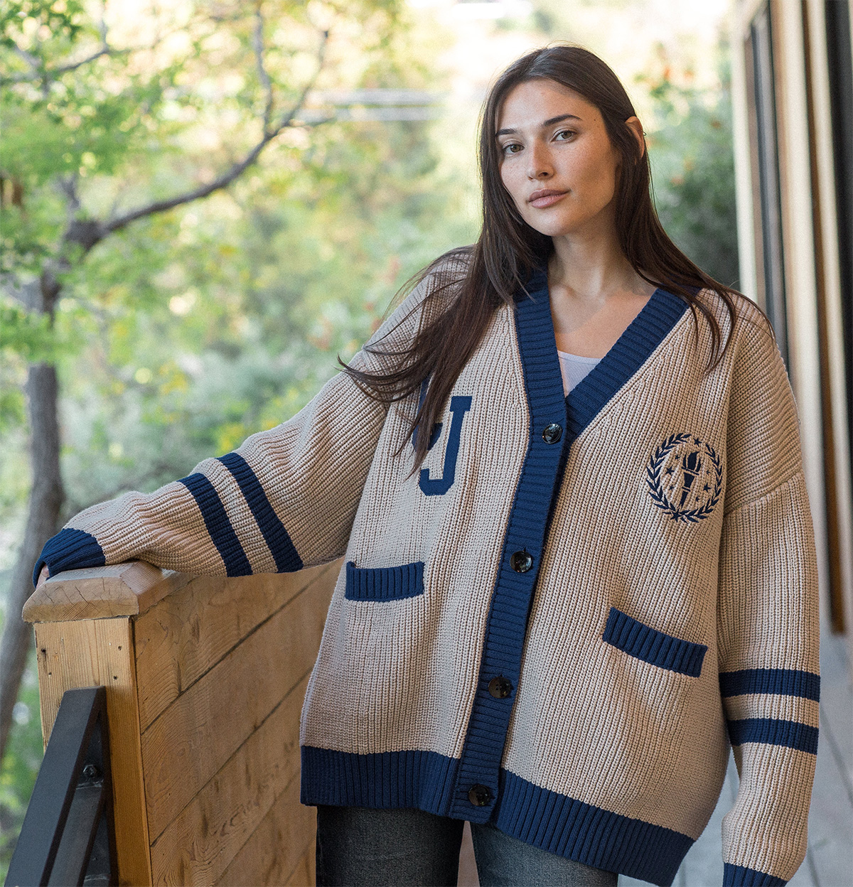 woman wearing a Crime Junkie cardigan