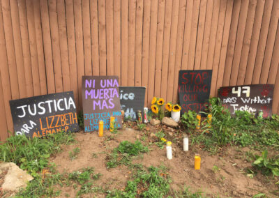 Lizzbeth’s loved ones and supporters put up signs, candles, and flowers near the place her body was found.