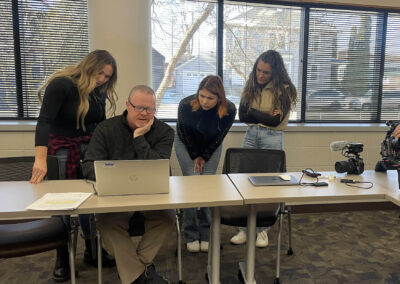 Sheboygan County Detective Nathan Hatch shows the audiochuck team photos ahead of his interview about his Rhys Pocan investigation.