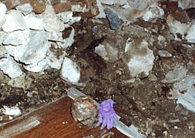 The skull and surrounding construction debris in a crime scene photo.