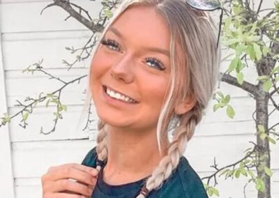 Madison “Maddie” Mogen posing infront of tree