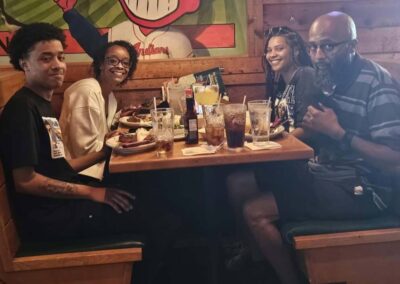 Christion with his mother, father, and sister.