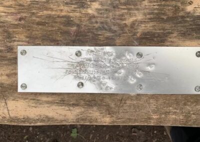 The plaque bolted to a bench just outside of Rhuddlan.