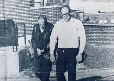 Bobby (Left) being led to a court hearing after Barbara’s death
