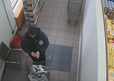 Surveillance footage of Sean at the grocery store on the morning of the fire.
