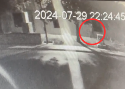A person walking around the loading dock after the Kia Soul leaves