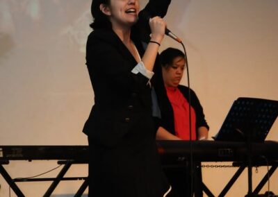 Brit Prawat leading worship in 2010