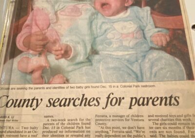 A newspaper clipping reporting the discovery of two young girls abandoned at Colonia Park in Oxnard, California, in December 1989.