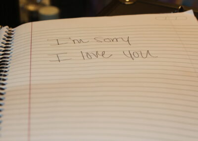 The notebook found on the bathroom counter that says “I’m sorry, I love you.”